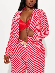 Close-up view of a vibrant red and pink striped pajama set with gold embroidery on pocket