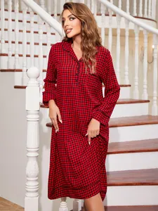 Elegant red buffalo plaid long sleeve nightgown for women in a cozy indoor home setting