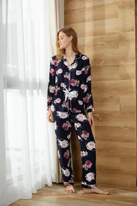 Full view of women's floral print two-piece pajama set with long-sleeve cardigan