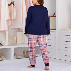 Plus size women's long sleeve pajamas set with navy top and plaid trousers
