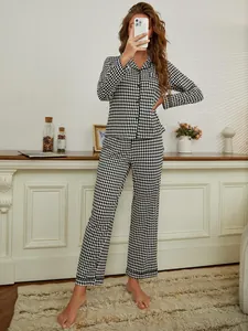 Full view of elegant black and white diamond pattern long-sleeved pajama set for women