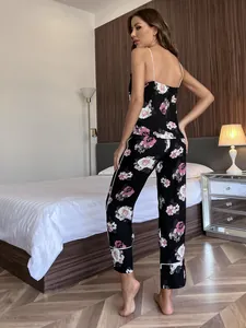 Detailed back view of a sexy black floral pajama set including camisole and long pants.