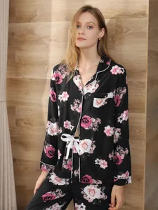 Women's elegant floral pajama set featuring long sleeve button-down top and pants