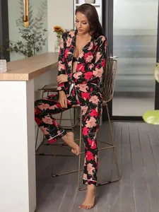 Elegant floral print women's long-sleeve pajama set featuring a button-down top and matching pants