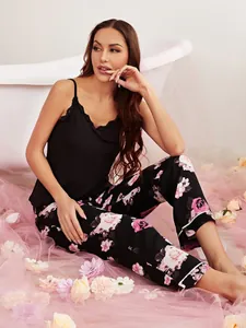 Women's sexy two-piece floral pajama set with black lace camisole and printed pants