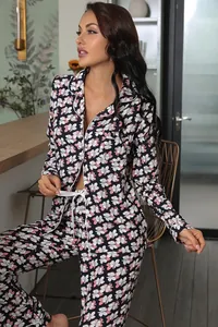 Elegant women's floral pajama set featuring a long-sleeve cardigan top and long pants