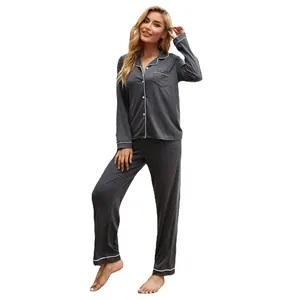 Classic dark gray long sleeve two-piece pajama set with white piping on pure background