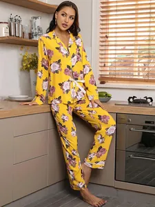 Elegant women's yellow floral long-sleeve pajama set shown in a cozy kitchen setting