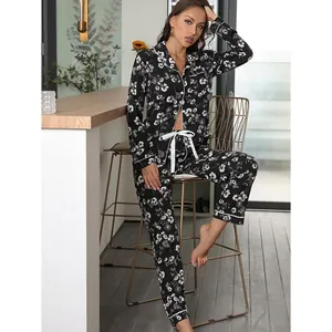 Women's black floral sleepwear pajama set with long sleeve button-down shirt and pants