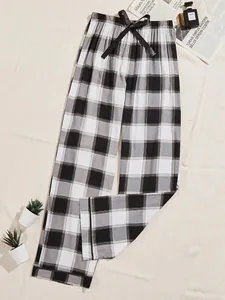 Elegant black and white plaid wide-leg pajama pants featuring a decorative waist bow detail.
