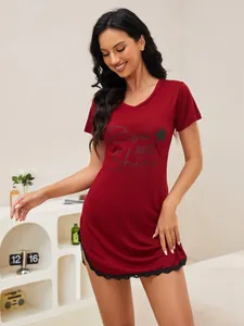 Close-up detail of burgundy short-sleeved nightgown with V-neck and black lace hem