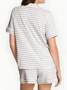 Back view of women's striped two-piece pajama set with short sleeves and shorts