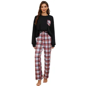 Comfortable women's two-piece plaid pajama set with long sleeves and black top for winter