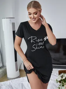 Black V-neck nightgown detail featuring white Rise and Shine print and delicate lace trim