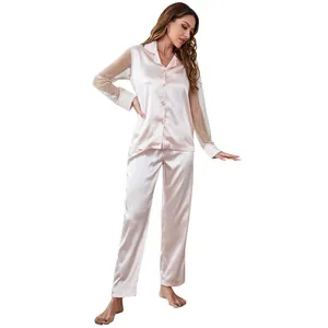 Full view of pink satin pajama set with elegant sheer mesh polka dot sleeves.