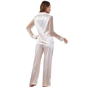 Elegant back view of pink satin pajama set featuring sheer polka dot mesh long sleeves