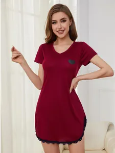 Detailed view of burgundy V-neck nightgown featuring heart print and delicate lace trim