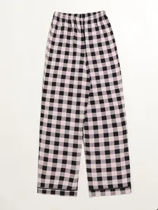 Detail of stylish pink and black checkered pajama pants for women with elastic waist.