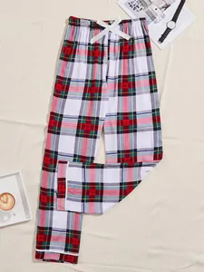 High-quality red and green plaid pajama pants for women featuring a white ribbon bow