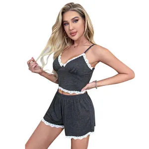 Detailed view of women's two-piece grey camisole and shorts pajama set with lace trim