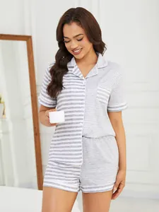 Detail of women's grey striped short sleeve pajama set with button-down top and shorts
