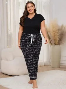 Plus size black pajama set with heart pattern pants and short sleeve top