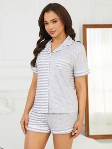 Professional studio shot of women's striped pajama set with button-up short sleeves and shorts