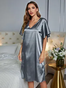 Elegantly draped grey ice silk V-neck nightgown for women in a cozy bedroom setting