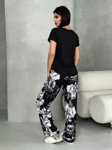 Detailed back view of women's floral pajama set with short-sleeved black top