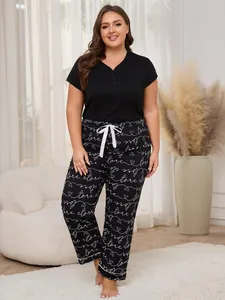 Plus size women's pajama set featuring V-neck short sleeve top and patterned long pants