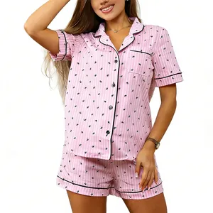 Women's pink striped pajama set with short sleeves, lapel collar, and bird pattern