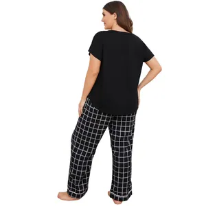 Back view of plus-size women's pajama set featuring black top and plaid trousers.