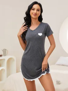 Close-up of a women's dark grey nightgown featuring a white heart print and lace trim.