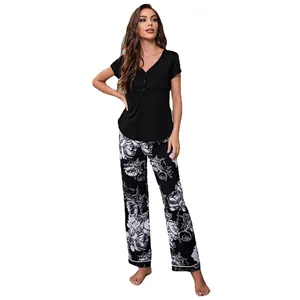 Women's 2-piece pajama set with black short sleeve henley top and floral print pants