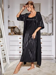 Full-length view of black striped satin silk pajamas set with nightdress and robe