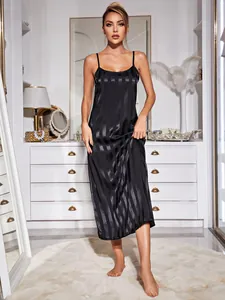 Elegant black satin slip nightdress featuring vertical stripes shown on a full-length model