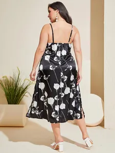 Back view of a plus size black satin nightdress with elegant white floral patterns.
