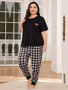 Plus size black short sleeve pajama set featuring red heart print and plaid heart pants