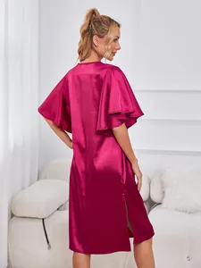 Back view of magenta satin nightgown with flutter sleeves and side slit detail