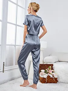Detail view of back for silky two-piece pajama set with cropped top and jogger pants.