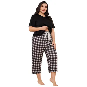 Comfortable plus size women's pajama set with black short sleeve tee and checkered heart pants