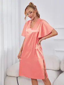 Elegant coral pink ice silk nightgown with flared short sleeves and sexy side slit detail