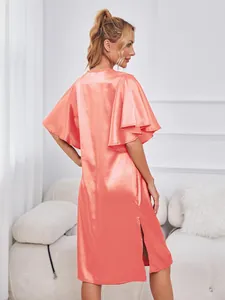 Elegant peach ice silk nightgown featuring flutter sleeves and a stylish side slit