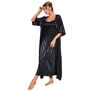 Detailed visual of women's luxurious black satin pajama set featuring vertical stripes