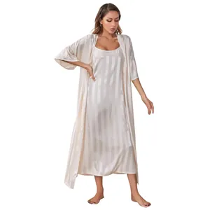 Full-length view of champagne striped silk camisole and robe two-piece pajama set