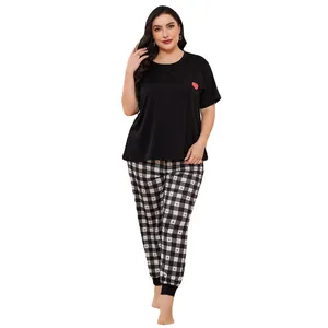 Plus size women's pajama set featuring a black heart print top and checkered long pants