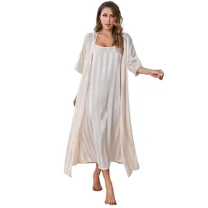 Full body view of women's silk satin pajamas set with striped nightgown and robe