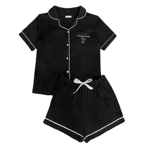 Classic women's black modal pajama set with short sleeves, shorts, and white piping.