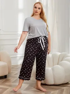 Plus size women's grey short sleeve top and heart print cropped pants loungewear set detail view