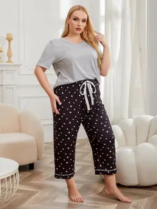 Two-piece plus size pajama set with grey short-sleeved top and heart print capri pants